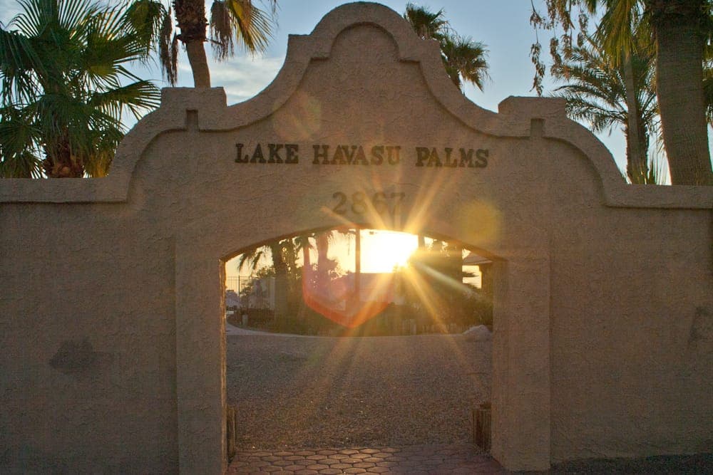 Lake Havasu Palms stucco entrance arch at sunset