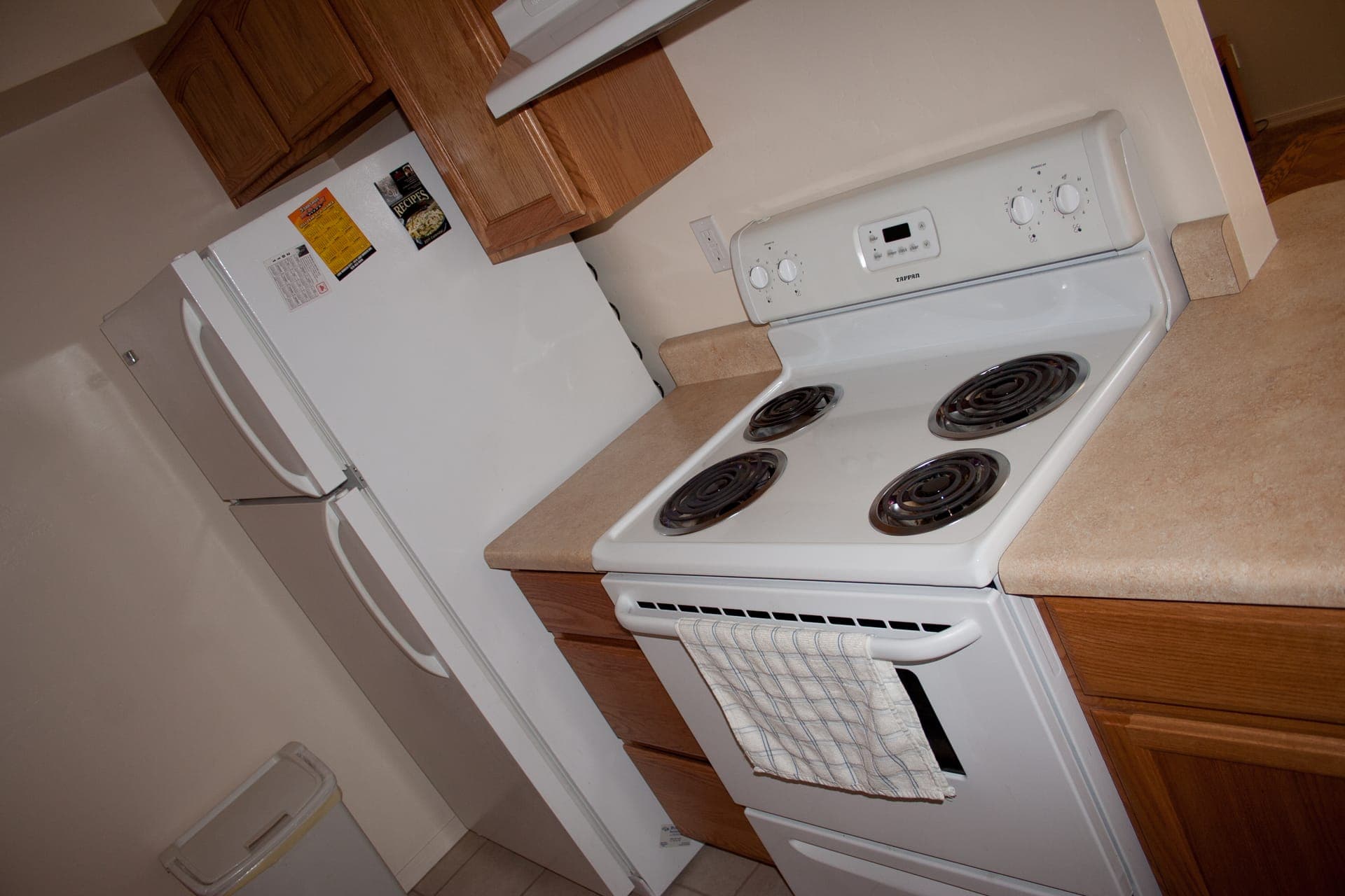 Full kitchen with range and refrigerator
