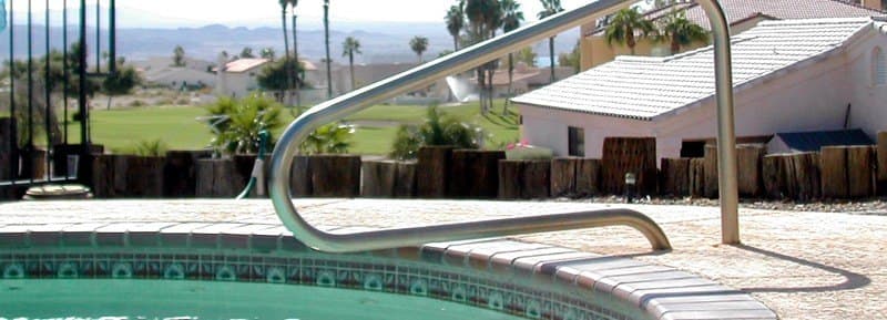 Splash pool with a handrail, looking out over the golf course toward the lake